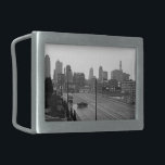 Kansas City Urban Skyline, Black and White Photo Belt Buckle<br><div class="desc">In Kansas City, Missouri, six lane Main Street stretches out from the bottom right corner of the black and white photograph towards the misty skyscraper horizon in the distance. A dark sedan, below and left of centre, drives perpendicular to the lanes of traffic creating a moment of intrigue in the...</div>