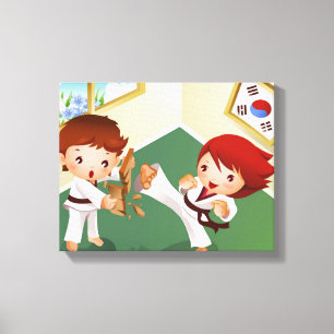 Karate boy holding wood with another breaking it canvas print