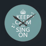 Keep Calm and Sing On - all colours Round Clock<br><div class="desc">This reads Keep Calm and Sing On, in the style of the classic keep calm poster. There are music notes floating beside the words. It's one of my most popular designs, and popular with everyone who loves to sing. You can change the background colour really easily, just press customize. If...</div>