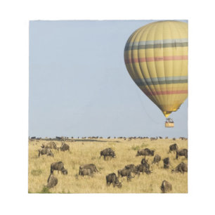 Kenya, Masai Mara. Tourists ride hot air balloon Notepad
