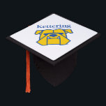 Kettering University Graduation Cap Topper<br><div class="desc">Level up your collegiate pride with this official Kettering University branding! Whether you are a future engineer conquering your intense co-op terms, a dedicated student making things happen on campus, or a proud alum innovating out in the industry, this authentic university mark is exactly what you need. It is the...</div>