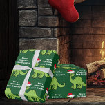 Kids Christmas Dinosaur Cute Custom Green  Wrapping Paper<br><div class="desc">Awesome green dinosaur Christmas wrapping paper. This apatosaurus looks very cute in a holiday red Santa hat with a little smile. I like prehistoric Christmas animals and presents that kids will love. Customize this gift with the recipient's name to make it even more personalized.</div>