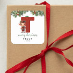 Kids Elf Initial T Christmas Square Sticker<br><div class="desc">Give the gift of personalized charm this Christmas! Our monogram stickers,  featuring Santa's elf hiding behind the letter T,  are a unique and thoughtful way to show your love. Customize with a name,  year and a heartfelt greeting. Make your Christmas gifts stand out!</div>