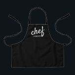 Kid's Modern Chef Script Type Name Personalized  Apron<br><div class="desc">Introduce your budding culinary genius to the joys of cooking with the "Kid's Modern Chef Script Type Name Personalized Apron." This apron is not just a practical garment for cooking; it's a statement of encouragement for your child's growing talents in the kitchen. Perfect for young food enthusiasts and aspiring chefs,...</div>
