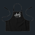 Kid's Modern Chef Script Type Name Personalized  Apron<br><div class="desc">Introduce your budding culinary genius to the joys of cooking with the "Kid's Modern Chef Script Type Name Personalized Apron." This apron is not just a practical garment for cooking; it's a statement of encouragement for your child's growing talents in the kitchen. Perfect for young food enthusiasts and aspiring chefs,...</div>