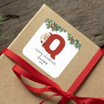 Kids Monogram Christmas Square Sticker<br><div class="desc">Give the gift of personalized charm this Christmas! Our monogram stickers,  featuring Santa hiding behind the letter Q,  are a unique and thoughtful way to show your love. Customize with a name,  year and a heartfelt greeting. Make your Christmas gifts stand out!</div>