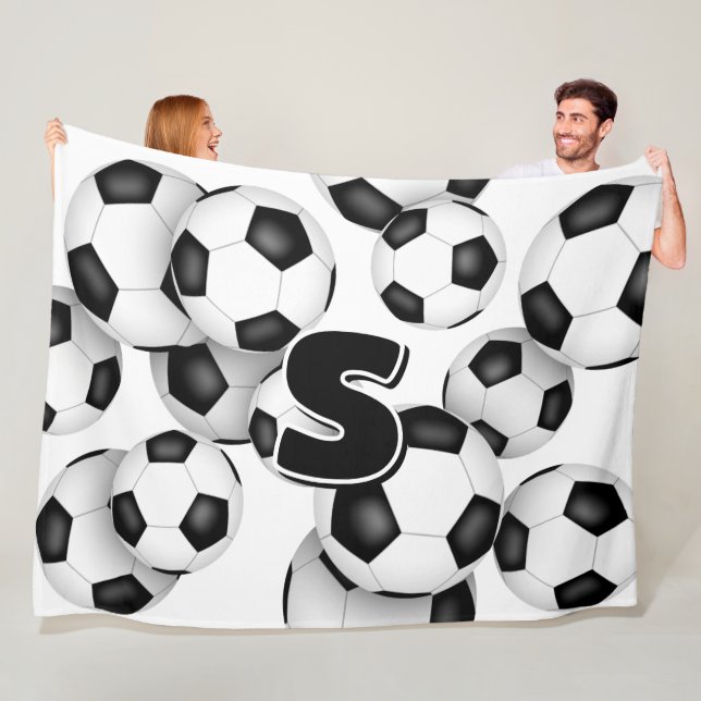 kids monogram overlying giant soccer balls fleece blanket (In Situ)
