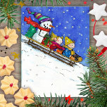 KIDS ON SLED postcard by Nicole Janes<br><div class="desc">A little boy,  a little girl and a happy snowman shoot down a hill on a sled.</div>