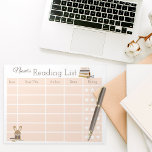 Kids Reading Books Log Notepad<br><div class="desc">Make tracking reading and rating books a blast with our adorable Kids Reading Log Notepad! This notepad features a cute bunny nestled beside a stack of books in neutral colors. Your kids will keep track of their reading adventures without any problem. The built-in star rating notepad simplifies reviewing books, making...</div>