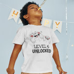 Kids Video Gaming T-Shirt<br><div class="desc">These cool gamer tshirts featuring two gaming control pads over a white background, with playful text that reads "LEVEL 6 UNLOCKED" and "THEIR NAME AND AGE". All font styles and colours can be changed by clicking on the customize further link after personalizing.</div>