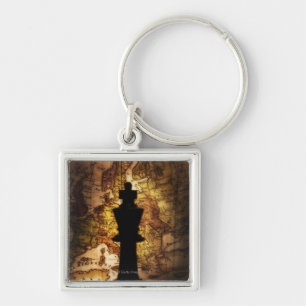 King chess piece on old world map keychain