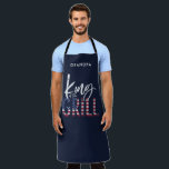 King of the grill apron<br><div class="desc">King of the grill, the perfect gift for the summer chef in your life. A idea birthday, Christmas, mothers day or fathers day gift or just a thank you for a awesome day! In patriotic red, white and blue with on trend script text and a cool vintage distressed feel, this...</div>