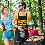 King of the Grill Graphic Apron<br><div class="desc">Is there a guy in your life that's obsessed with barbecuing and cooking meal on the grill? He just might be the King of the Grill. Let him know how much you appreciate his cooking skills with this fun graphic apron. It's perfect for wearing while he's out cooking up a...</div>