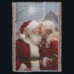 Kissing Mr and Mrs Santa Claus Throw Blanket<br><div class="desc">Cute photograph from Santa Claus and his wife kissing in the snow</div>