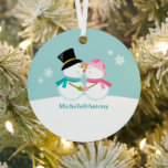 Kissing Snowmen Christmas Metal Ornament<br><div class="desc">Custom Christmas ornament featuring an adorable and unique vector illustration  of a couple of snowmen kissing in the snow on a winter blue background. Personalize it with your names,  wedding anniversary date,  or any text of your choice to make the perfect First Christmas  or couple ornament keepsake.
  ©Sanqunetti Design</div>