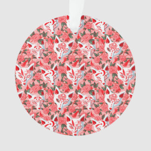 Kitsune masks and blooming camellia on pink ornament