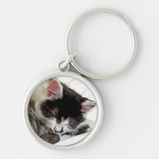 Kitten asleep on White Comforter Keychain