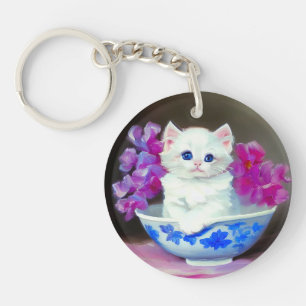 Kitten blanc vintage aux fleurs roses