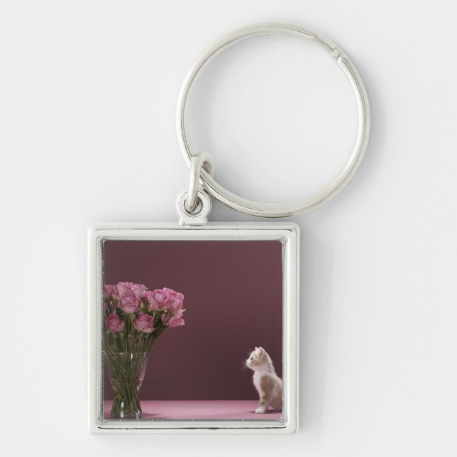 Kitten looking at vase of roses keychain (Front)