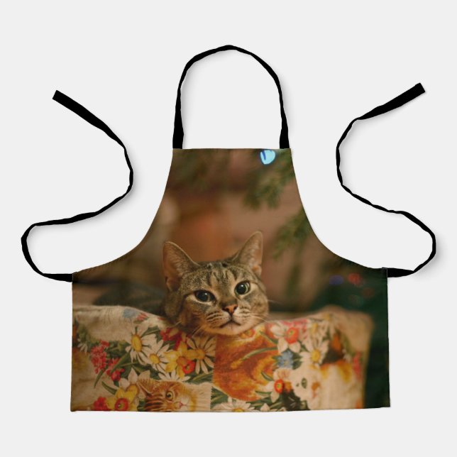 Kitten peeking behind the Christmas tree Apron (Front)