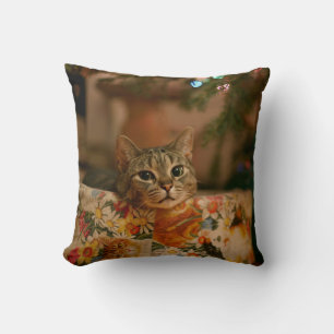 Kitten peeking behind the Christmas tree Throw Pillow