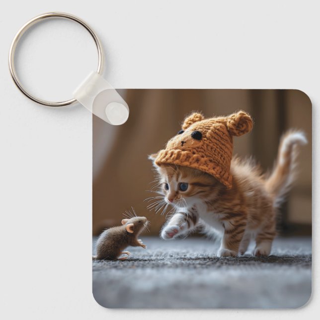 Kitten playing with a small mouse keychain (Front)