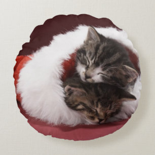 Kittens asleep together in Christmas hat Round Pillow