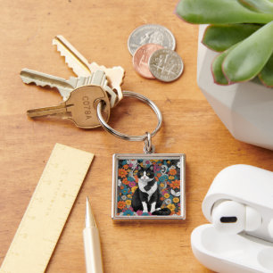 Kitty among the flowers keychain