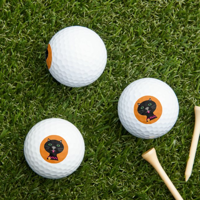 Kitty cat orange background golf balls (Insitu Grass)