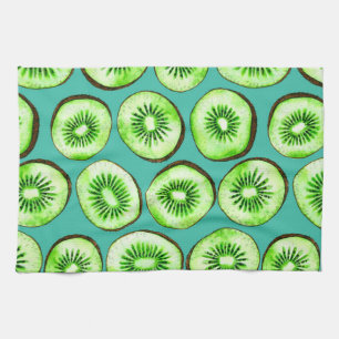 Kiwi slices on turquoise kitchen towel