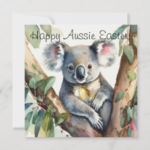 Koala bear holding a gold easter egg card