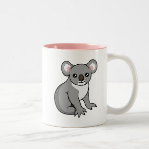Koala gris heureux mignon dessinant la tasse rose