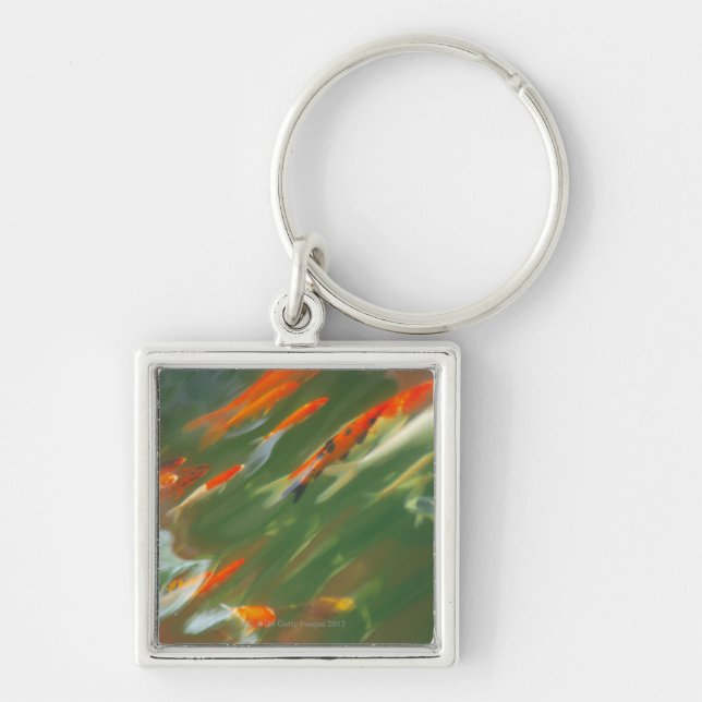 Koi carp fish swimming in a pond keychain (Front)