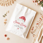 KRIS Cute and Modern Santa Baby Shower Favour Bag<br><div class="desc">This "Santa Baby" baby shower favour bag features a watercolor Santa hat and a cute modern retry inspired font. This baby shower gift bag is perfect for your Christmas,  winter,  or holiday themed event. Pair with anything in the KRIS Collection for a cohesive look.</div>