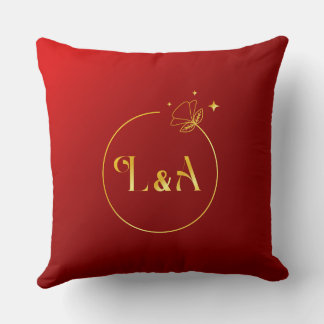 L et A Or métallique et coussin rouge royal