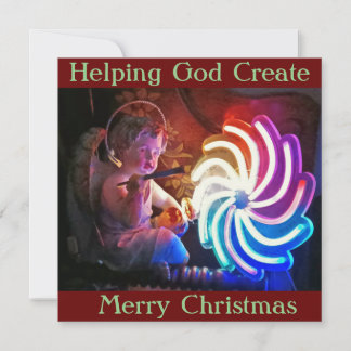 La carte de Noël montre Cherub "aidant Dieu à crée