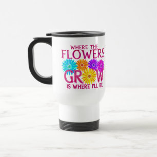 Là où les fleurs élèvent des tasses de voyage
