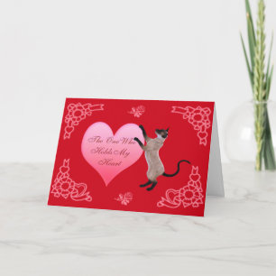 La personne qui tient ma carte de coeur