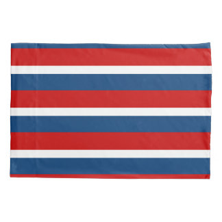 La taie d'oreiller rayée blanche et bleue rouge