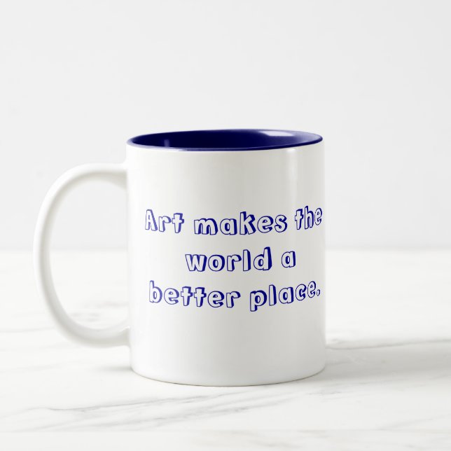 La tasse de bicyclette avec le "art font au monde (Gauche)