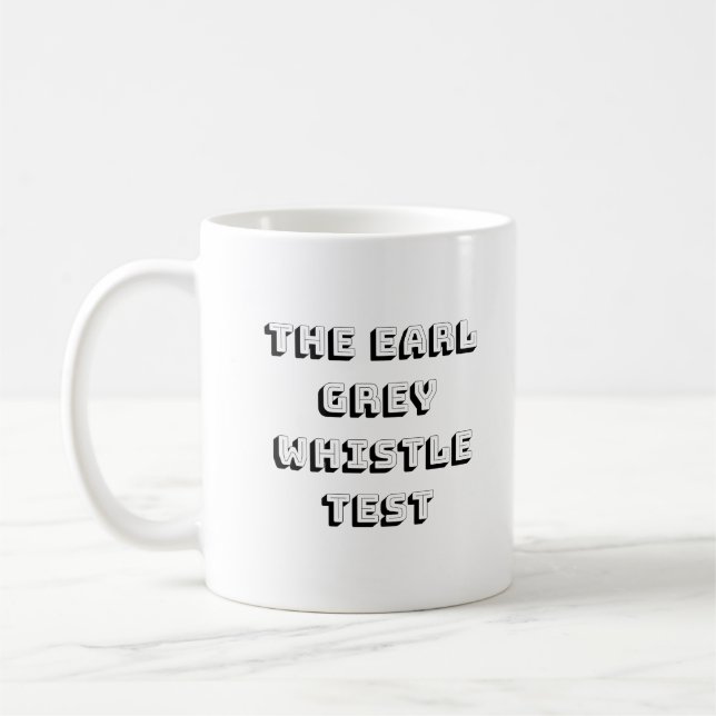 La tasse grise d'essai de sifflement de comte (Gauche)