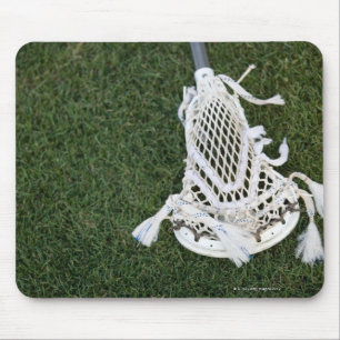 Lacrosse stick on grass mouse pad