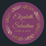 Lacy Gold Filigree Elegant Cassis Purple Wedding Classic Round Sticker<br><div class="desc">These elegant wedding stickers feature fancy gold script text on a cassis purple,  magenta,  or berry coloured background with a lacy gold faux foil floral border. The text is fully customizable and contains the wedding couple's names and wedding date. Great as favour tags or envelope seals!</div>