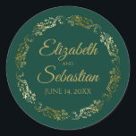 Lacy Gold Filigree Elegant Emerald Green Wedding Classic Round Sticker<br><div class="desc">These elegant wedding stickers feature fancy gold script text on an emerald green background with a lacy gold faux foil floral border. The text is fully customizable and contains the wedding couple's names and wedding date. Great as favour tags or envelope seals!</div>