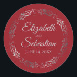 Lacy Silver Filigree Elegant Red Wedding Classic Round Sticker<br><div class="desc">These elegant wedding stickers feature fancy pale grey script text on a red background with a lacy silver faux foil floral border. The text is fully customizable and contains the wedding couple's names and wedding date. Great as favour tags or envelope seals!</div>
