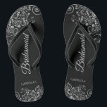 Lacy Silver on Black Elegant Bridesmaid Wedding Flip Flops<br><div class="desc">These elegant wedding flip flops are a great way to thank and recognize your bridesmaids, while giving their feet a rest after a long day. The beautiful design features an elegant design with ornate silver grey frills on a black background and fancy grey script lettering. The text reads Bridesmaid with...</div>