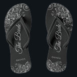 Lacy Silver on Black Elegant The Bride Wedding Flip Flops<br><div class="desc">Dance the night away with these beautiful wedding flip flops. Designed for the bride, they feature a simple yet elegant design with grey script lettering on a classic black background and fancy silver grey decorative curls and swirls. Beautiful way to stay fancy and appropriate while giving your feet a break...</div>