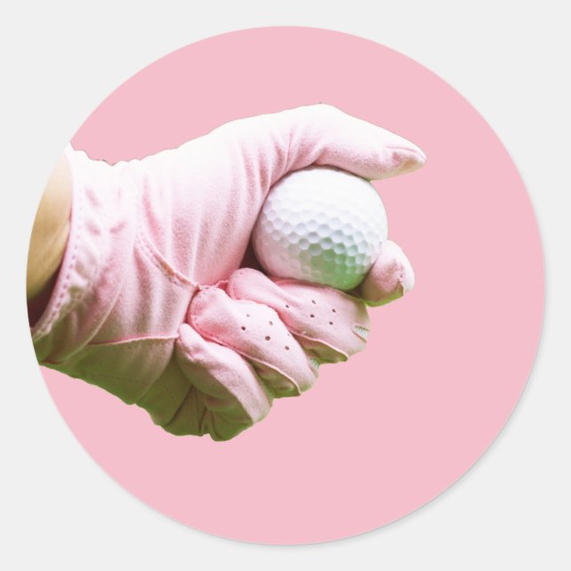 Lady golfer in pink glove is holding golf ball classic round sticker (Front)