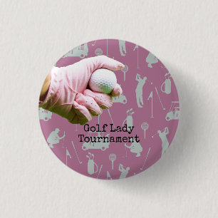 Lady golfer is holding golf ball on pinkbackground 1 inch round button