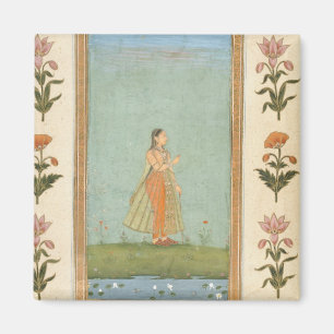 Lady holding a flower, standing by a lily pond, fr magnet